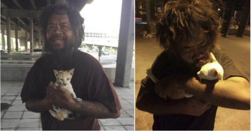 uomo malandato con gatti in braccio